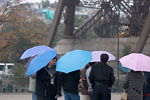 Paris - Blue and pink umbrellas under the Eiffel tower
